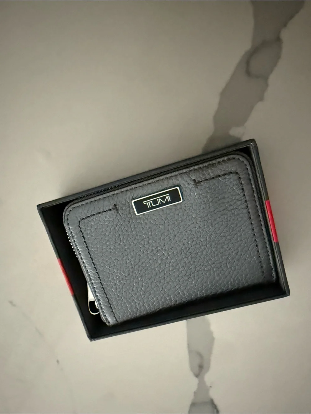 Tumi Gun Metal Wallet with Silver Logo and Zipper